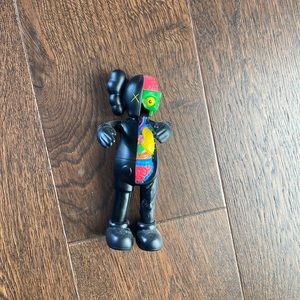 Exclusive kaws collectors item toy super rare kith black colorful